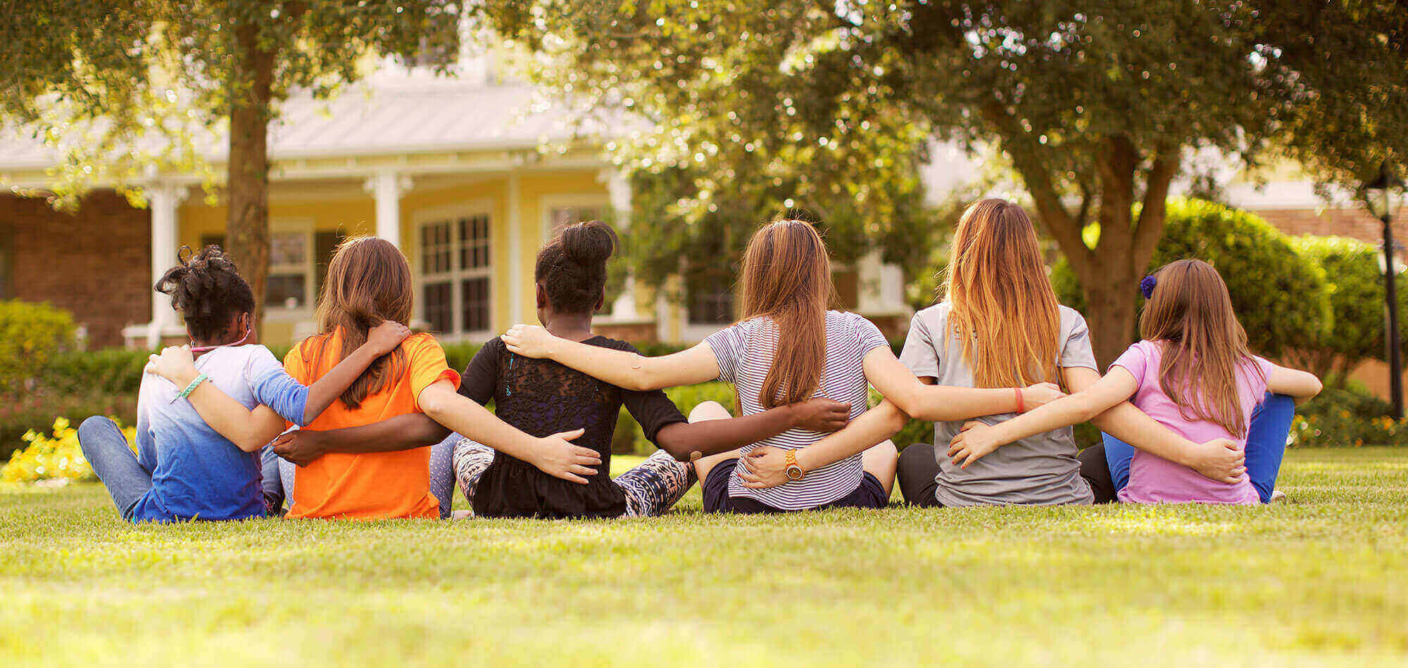 Girls Sitting on Grass